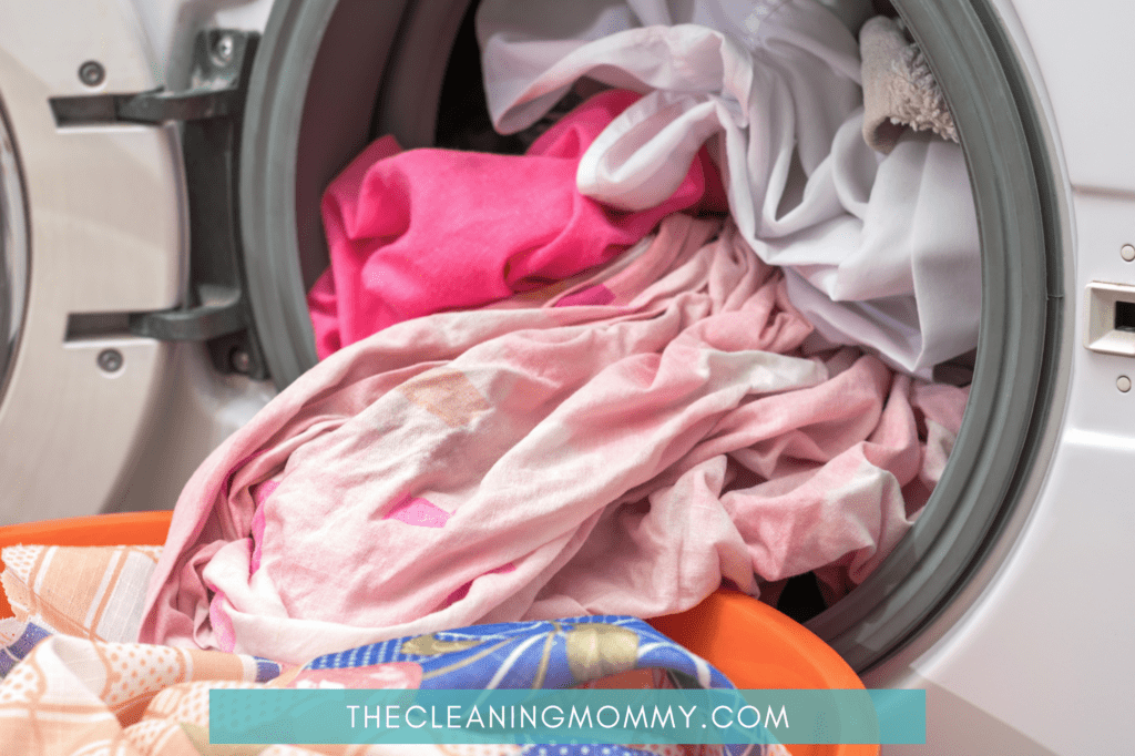 Pink, orange, blue clothes in washing machine