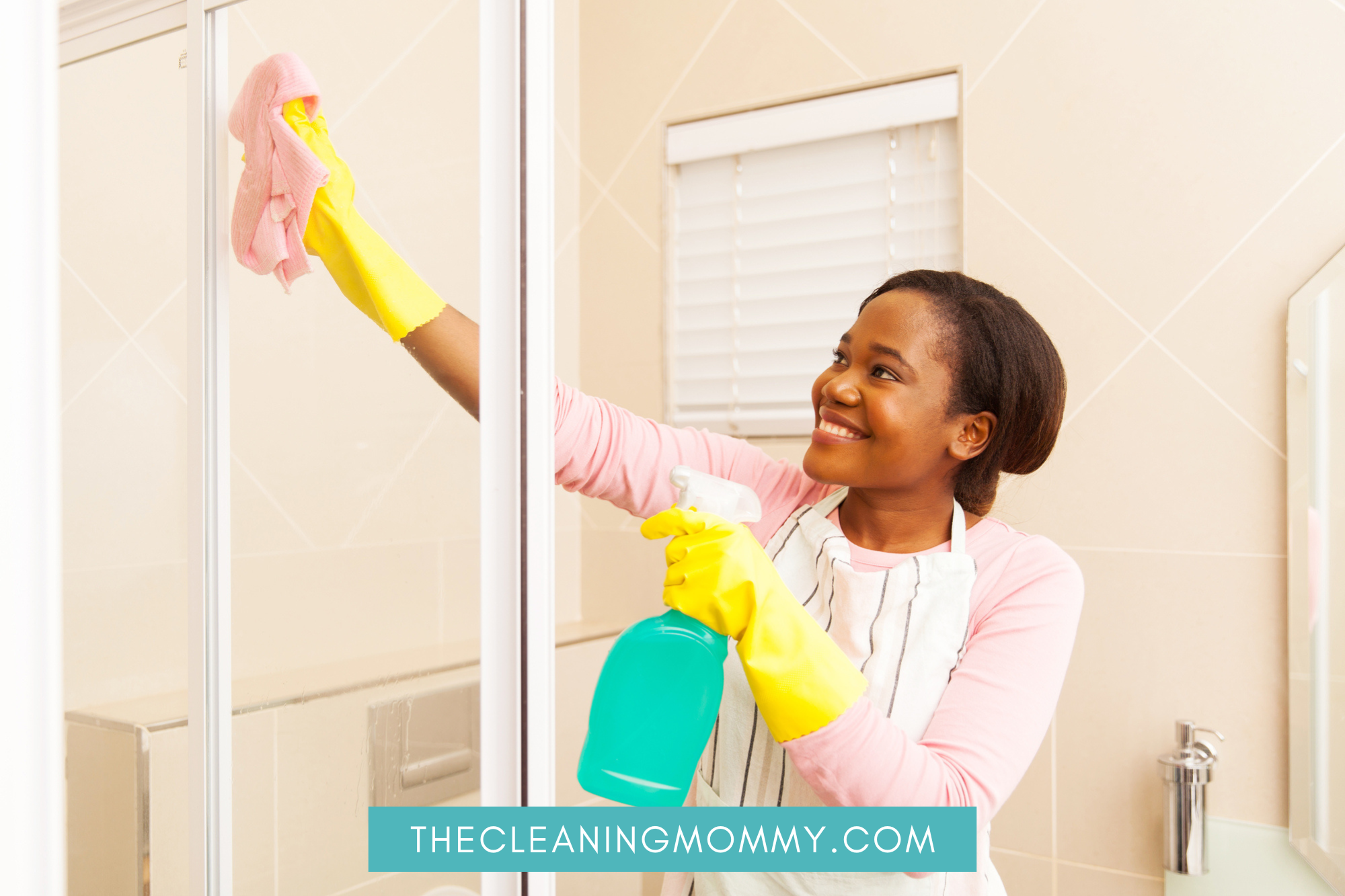 African American Woman Cleaning Glass Shower Doors