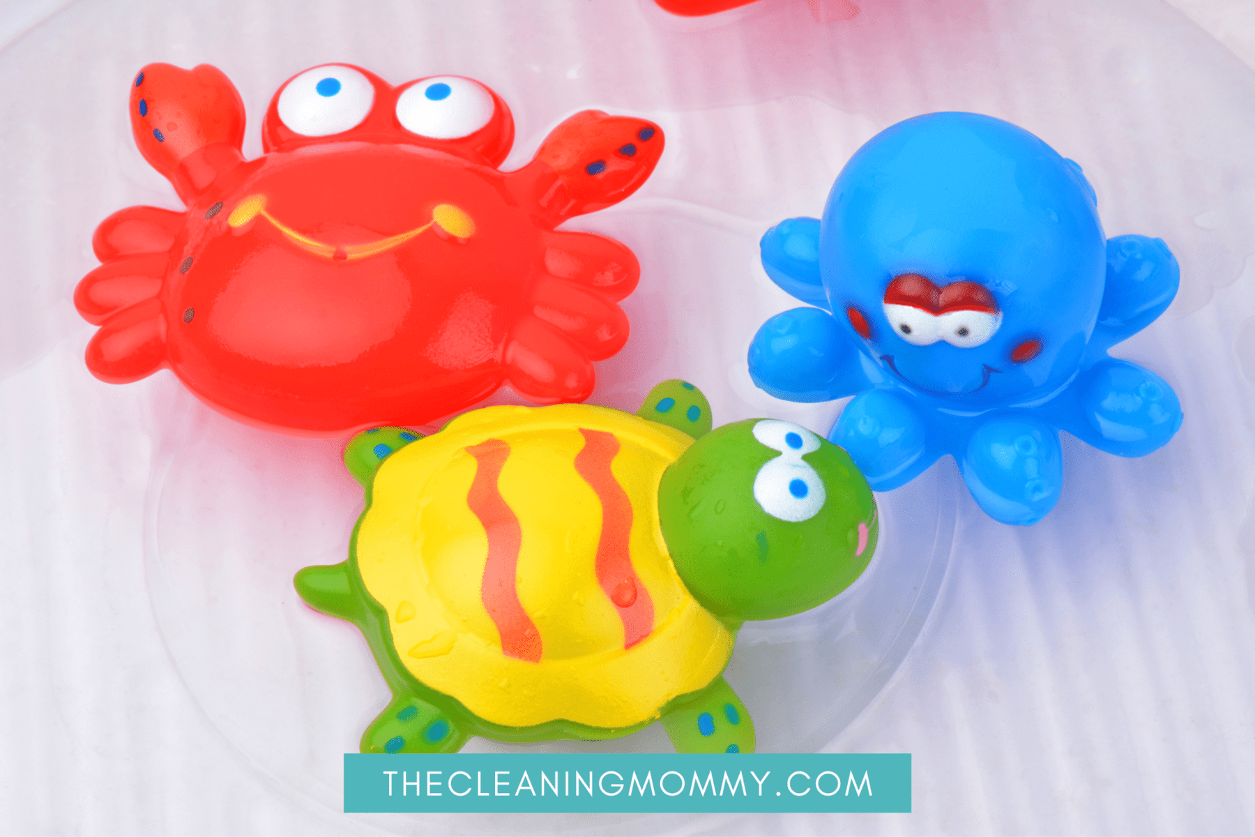 Red, blue bath toys, with green turtle bath toy