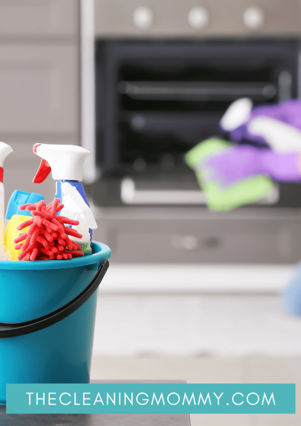 Mom cleaning fireplace, cleaning supplies in blue bucket