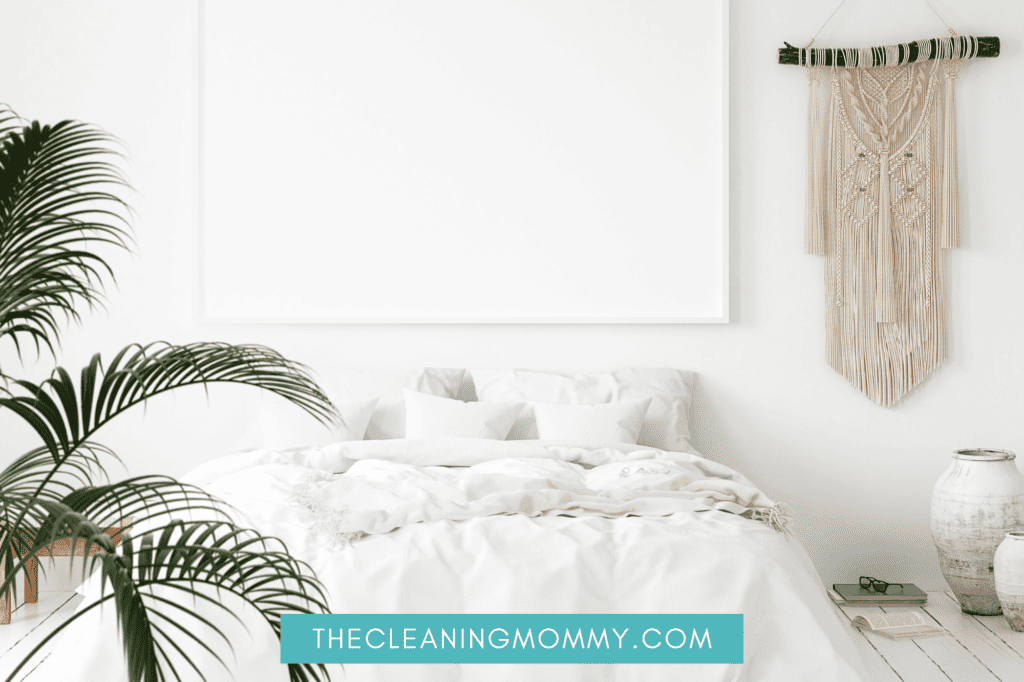 White bedroom with large green plants