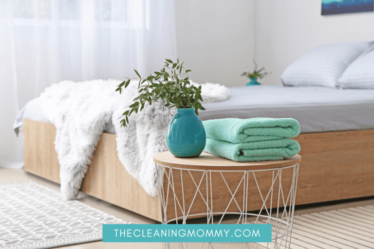 Beautiful clean bedroom with teal vase