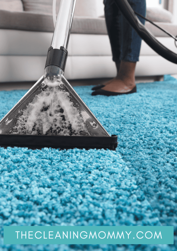Deep cleaning blue carpet with vacuum
