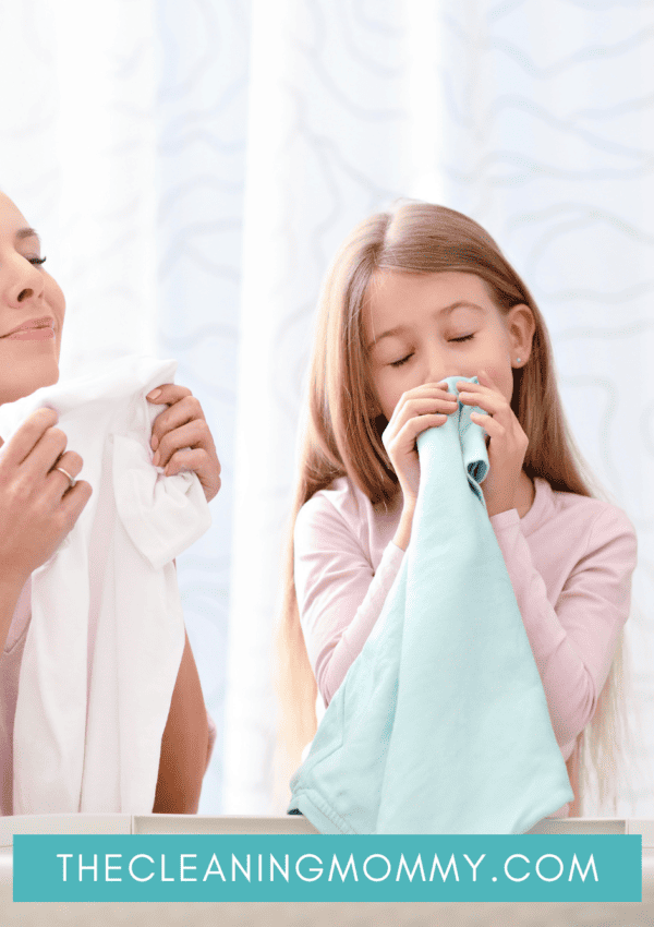 mom and daughter smelling fresh laundered clothes