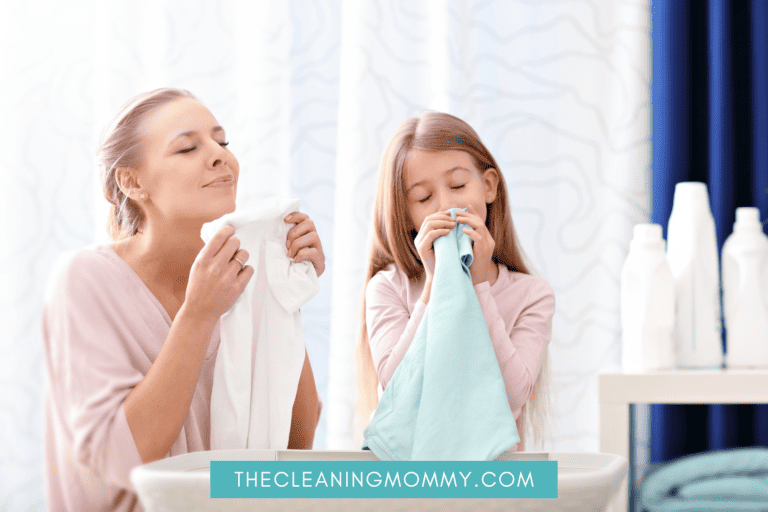 mom and daughter smelling fresh laundered clothes