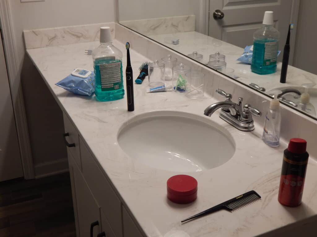 Cluttered bathroom counter area