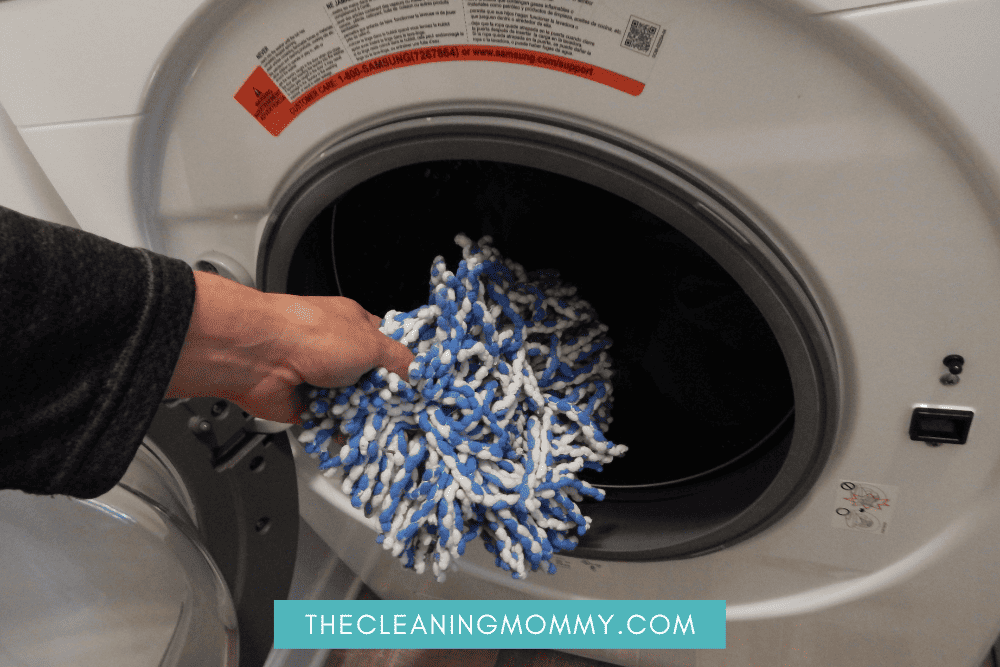 How to Wash a Spin Mop Head in the Washing Machine- putting the mop in the washer
